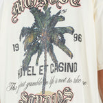Camiseta Palm Resort Crema | Camisetas Hotel y Casino | Monoic Studios